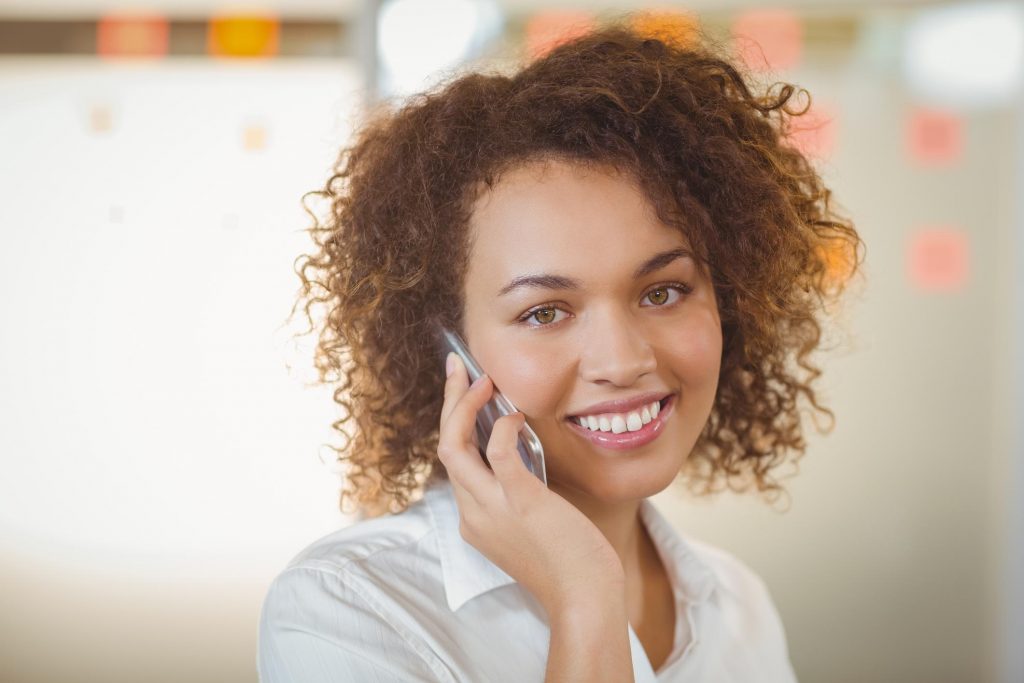 woman smile taking phone call