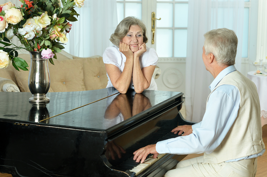 Portrait of happy beautiful elderly couple at home